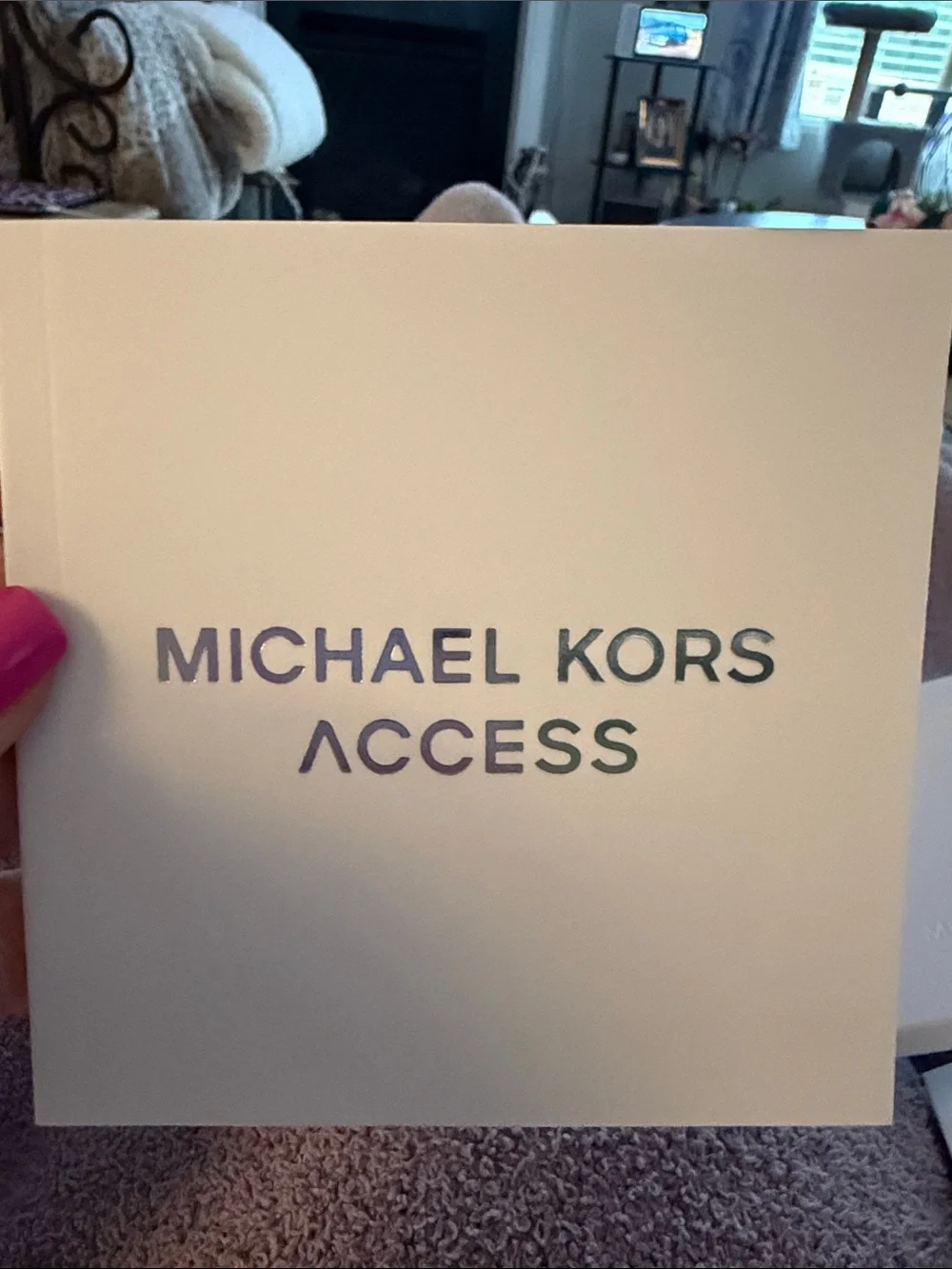 Michael Kors white braided activity tracker with silver-tone case